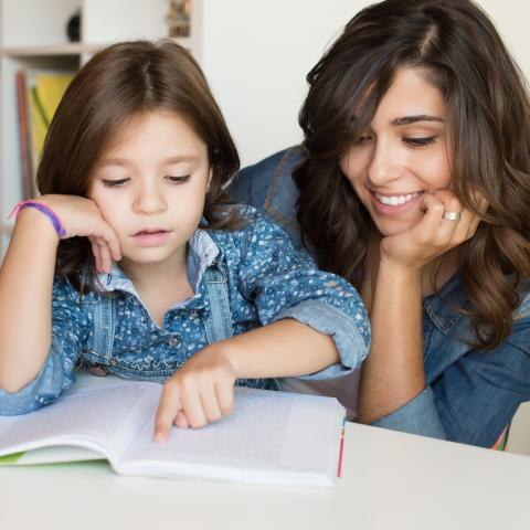 Mother listening to child read