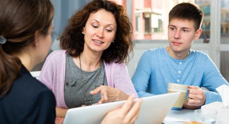 lawyer helping mother and teenage son